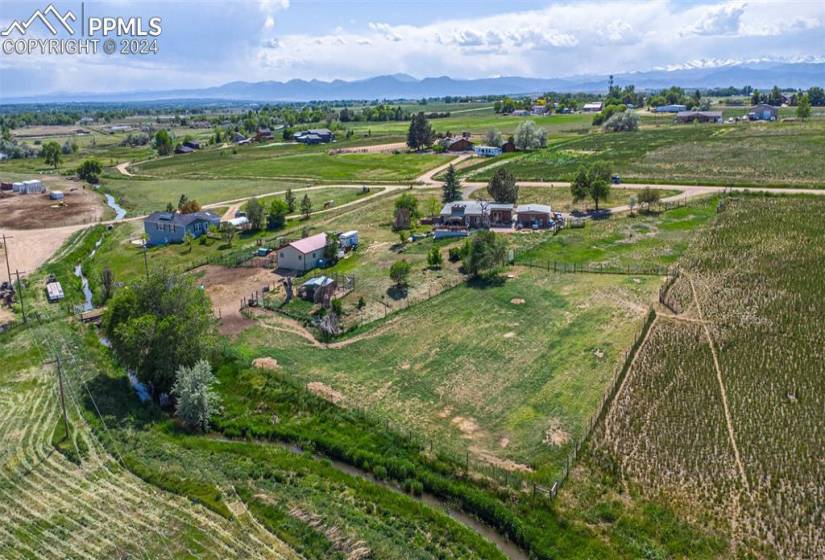 Birds eye view of property featuring a rural view and a mountain view