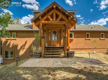 Welcome to this custom home in the country. Stucco sided home with lovely log accents. Stamped concrete front patio area.