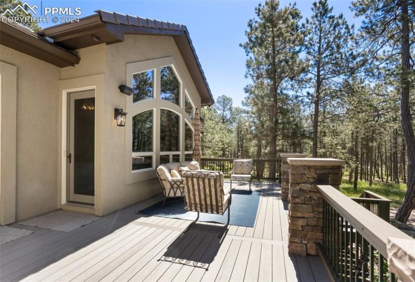 Over sized deck with entry door to Master Bedroom