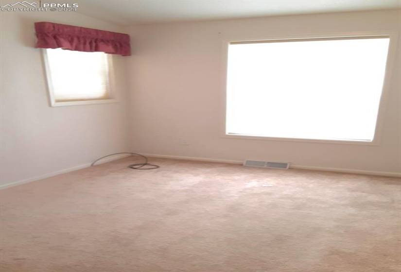 Empty room featuring carpet floors