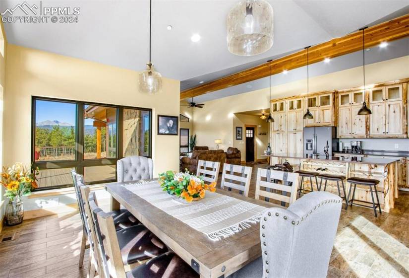 Dining area featuring ceiling fan and a mountain view