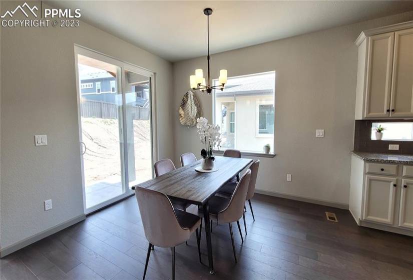 Dining Area with engineered hardwood flooring and walks out to patio!