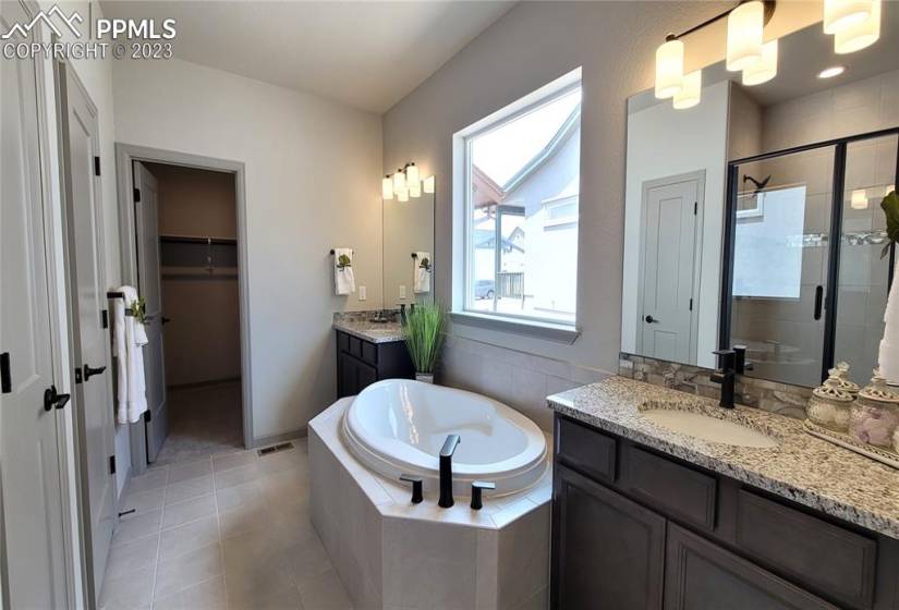 Plush 5-piece Bathroom with separated vanities and soaking tub!